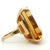 A vintage ring centered with a large emerald-cut citrine glowing in warm golden honey tones. The stone has wonderful depth...