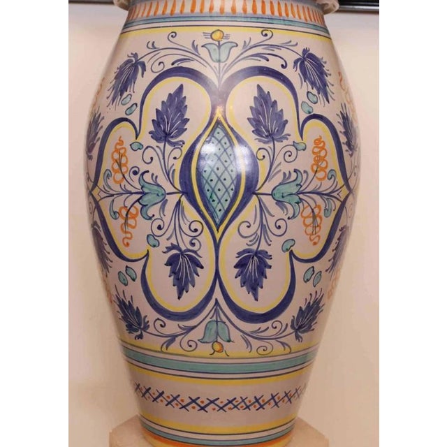 Italian stoneware vase with white glaze decorated with hand painting. Deruta is an Italian city with a very long tradition...