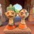 Striking pair of hand-painted papier-mache busts from India, rendered in classic Rajasthani folk style with bold features,...