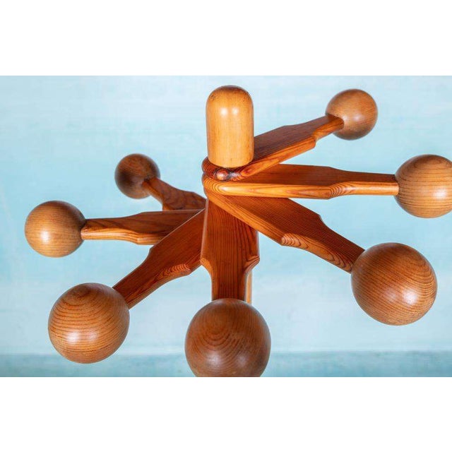 Minimalist designed coat rack from the seventies, made entirely of Scandinavian spruce wood; a feast for the eyes and an...