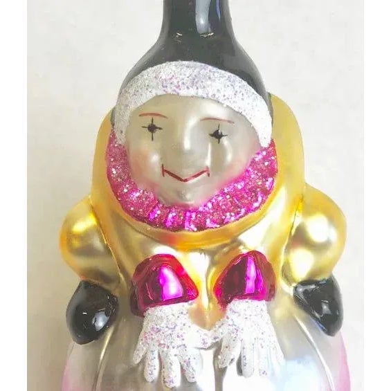 Christopher Radko Xmas Ornament -"Roly Poly". a 1990's blown glass item of an acrobatic figure perched on a large ball....