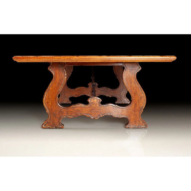 Handcrafted in Italy, this rustic coffee table embodies a charming blend of natural elegance and robust craftsmanship....