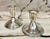 Pair of mismatched classic style Sterling Silver candle holder.marked on underside.