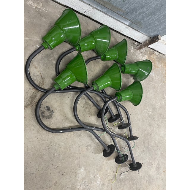 A rare opportunity to acquire a fully matched set of seven vintage Abolite industrial gooseneck wall lights—professionally...