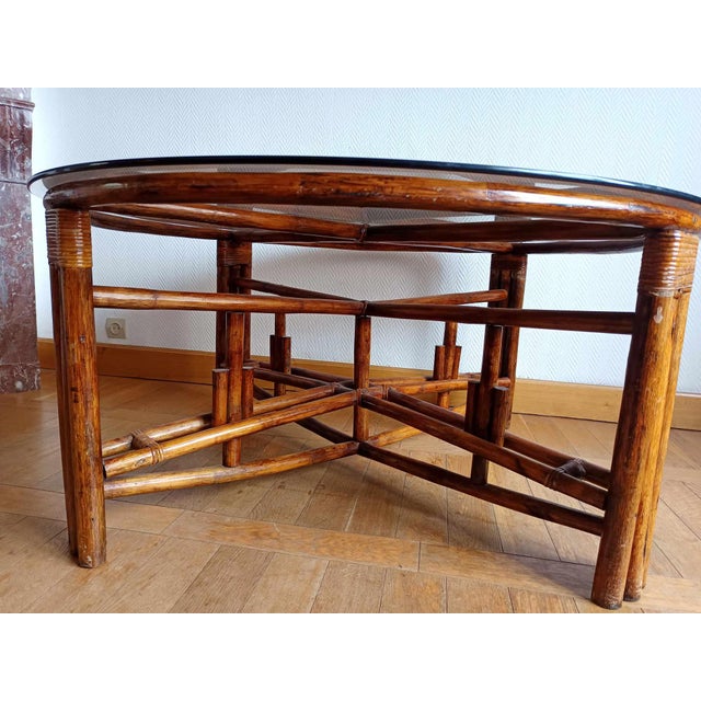 Large telescopic rattan table, vintage work circa 1970. X-shaped structure in rattan and braiding at the joints. Pivoting...