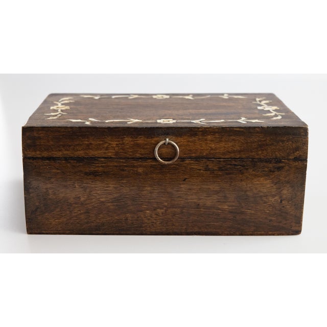 A superb antique English walnut box with mother of pearl inlay, circa 1900. This fine antique box is decorated with a...