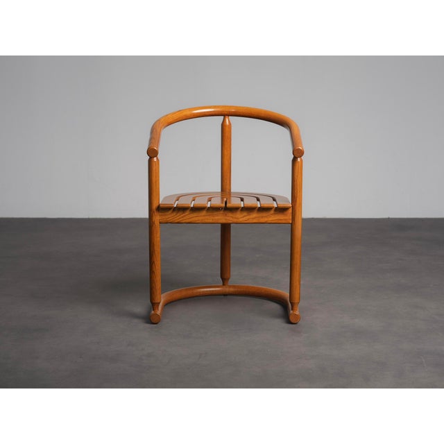 A striking set of six sculptural dining chairs produced by Allmilmö in Germany during the 1980s. The chairs feature an...