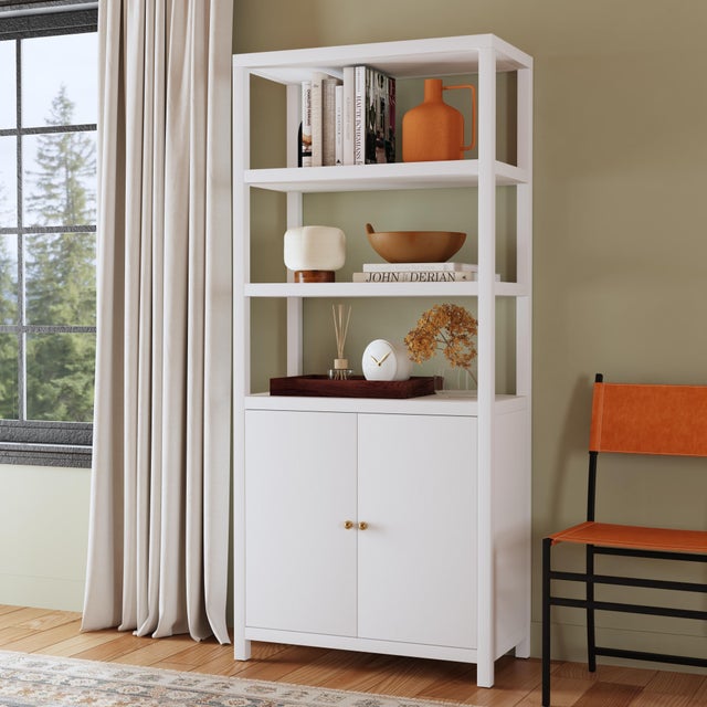 Sleek, refined, and endlessly functional, the Butler Specialty Company Nora Wood Etagere Bookcase with Cabinet is a...