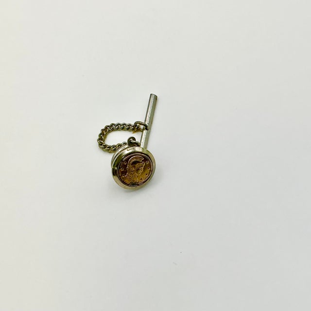 This is a dramatic faux Italian Roman Coin Tie Clip/Tack from the 1960s. We have curated a collection of Mid-Century Cuff...
