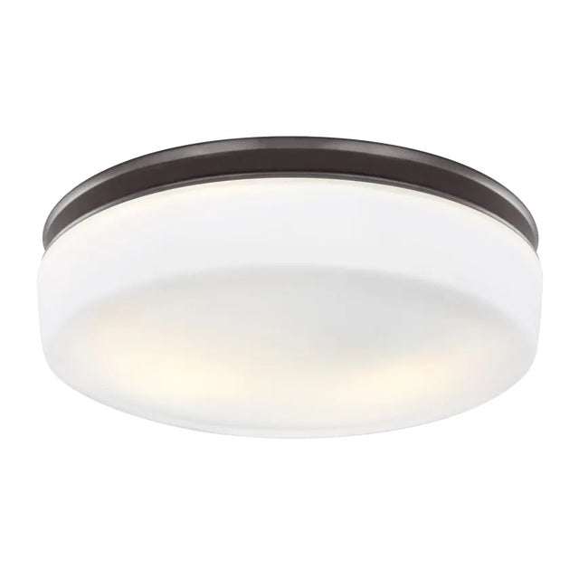 The Issen Flushmount lighting collection uses a delicate, pressed, White Opal Etched glass diffuser, which is presented in...