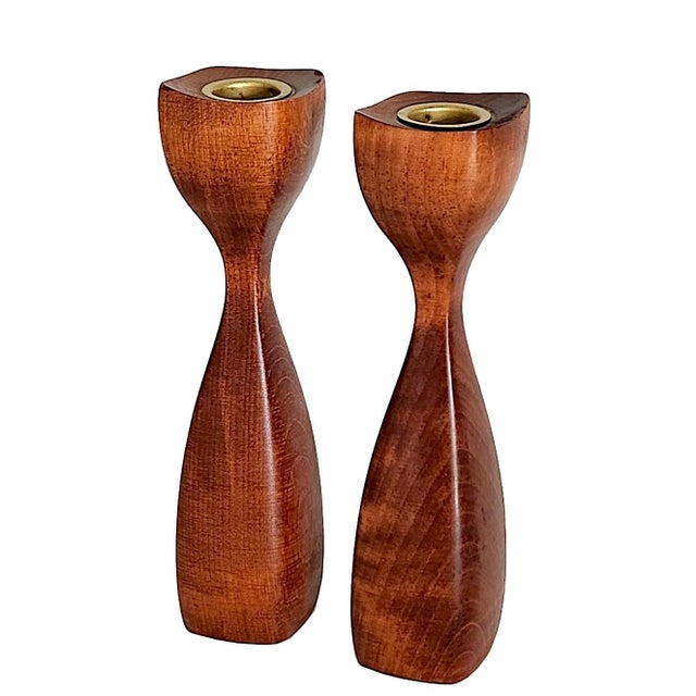 Offered is a pair of classic 1960s Danish Teak wood Tulip candlesticks. These are hand carved and crafted into an almost...