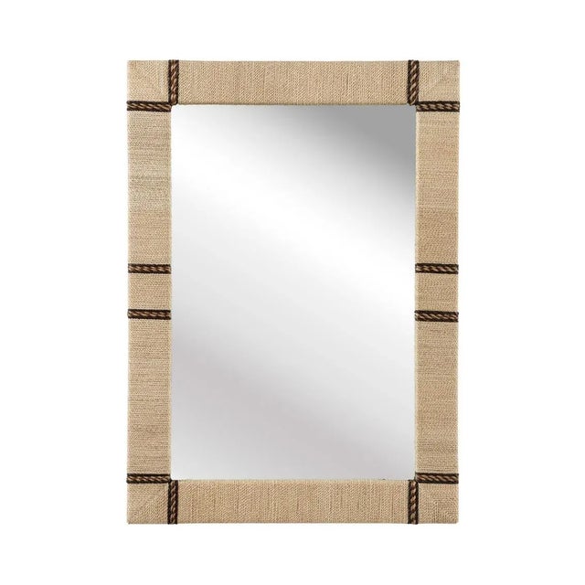 Wood frame is covered with cream abaca rope to give this mirror an organic, natural aesthetic.