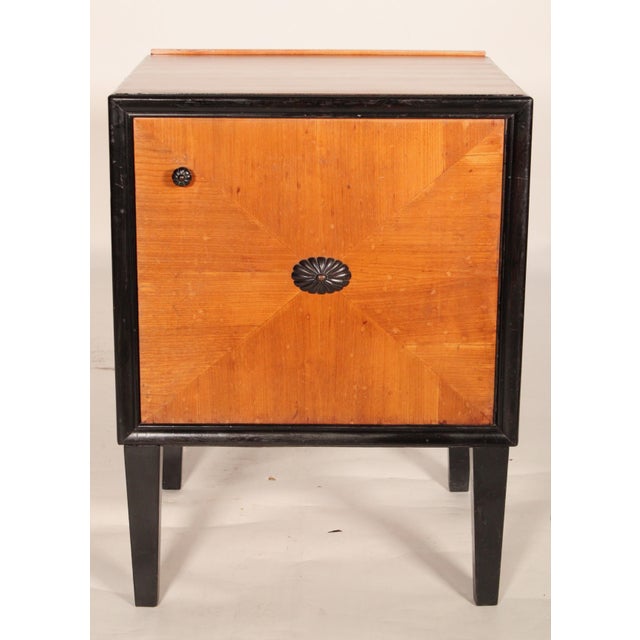 Art deco birch with ebonized trim nightstand / end table, circa 1930. With a birch top, sides and door with ebonized trim,...