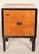 Art deco birch with ebonized trim nightstand / end table, circa 1930. With a birch top, sides and door with ebonized trim,...