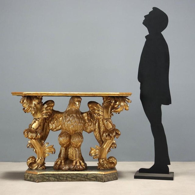 Baroque console table in carved and gilded wood, from Genoa and dating back to the first quarter of the 18th century. The...