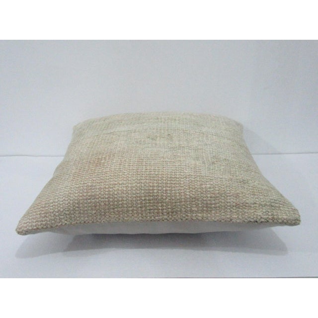 Decorative pillow cover made from a vintage Turkish handknotted rug. Backed with good quality cotton fabric. Pillow...