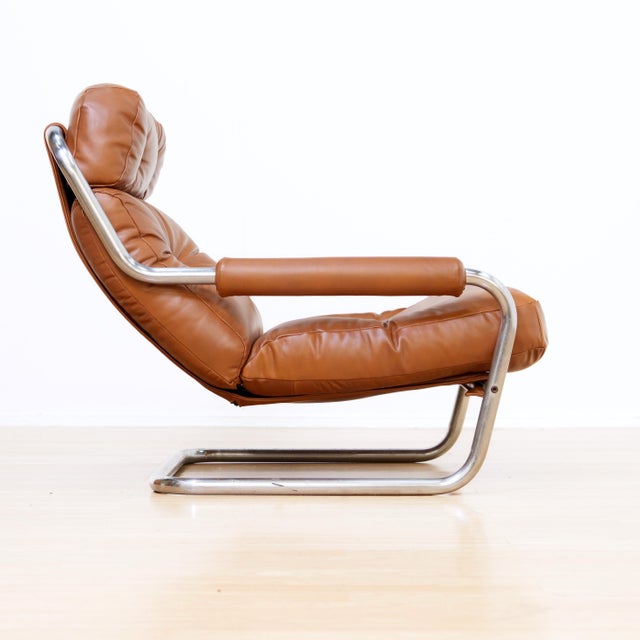 Exceptional vintage 1970s lounge chair attributed to Jan des Bouvrie for Gelderland, featuring a sculptural tubular chrome...