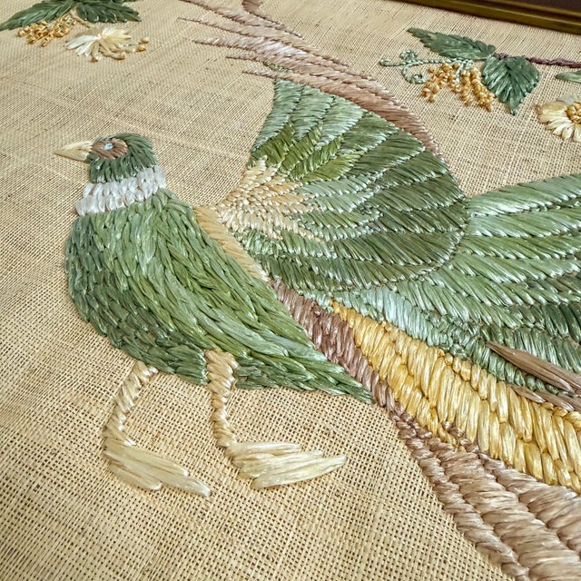 A beautifully executed vintage embroidered textile wall panel featuring three exotic birds perched among flowering...