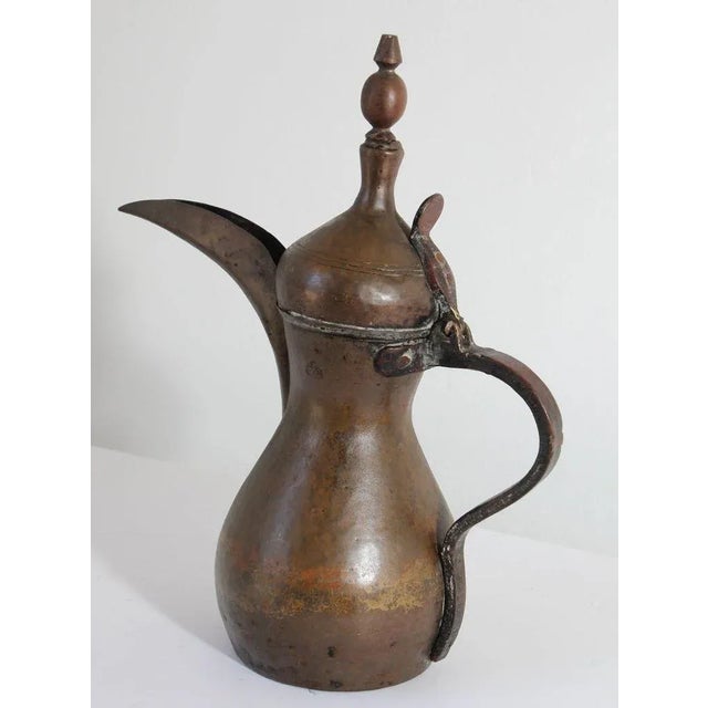 19th century Middle Eastern traditional Arabian tinned copper and brass Dallah coffee pot. Coffee pot hand-hammered and...