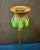 This vintage early 20th century authentic Tiffany Studios candlestick is decorated with blown out green color favrile art...