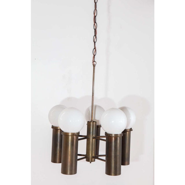 Old stock American chandelier with five up lights with 3 1/4" white globes and five down lights. Newly rewired for ten...