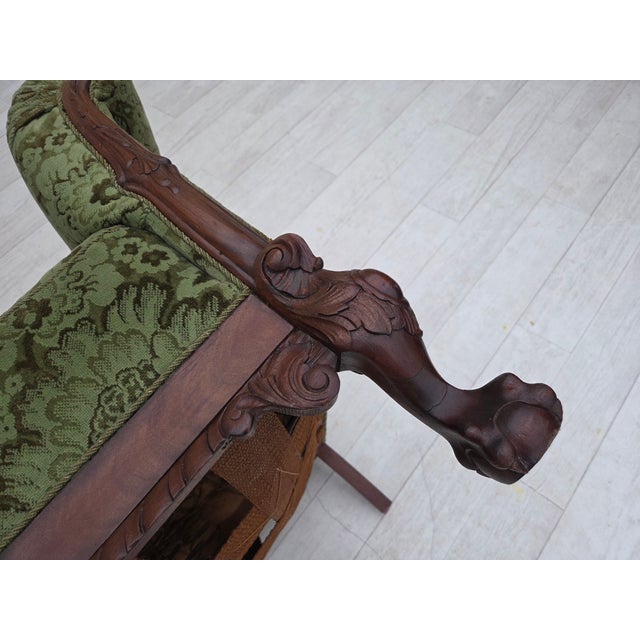 Chair was reupholstered by craftsman about 15 years ago. Very good condition: no smells, no stains and stable construction.