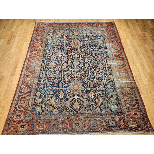 Discover a truly rare masterpiece from Northwest Persia: an exceptional 19th Century Hand-Knotted Persian Heriz Serapi...