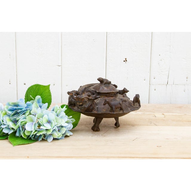 A beautiful ancient cast metal dragon tea pot from China, this antique tea pot made with incredible details including a...