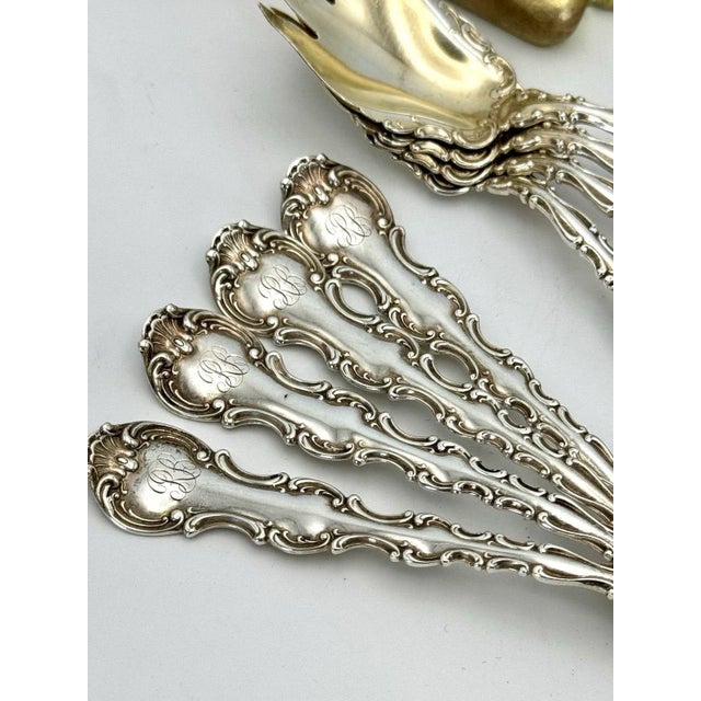 This set comprises eight antique Gorham ice cream forks in the Strasbourg pattern, crafted from sterling silver (.925)....
