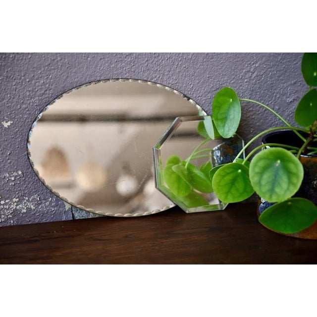 An oval and octagonal duo, here is a pretty pair of vintage mirrors with Art Deco accents. They have a nice beveled and...