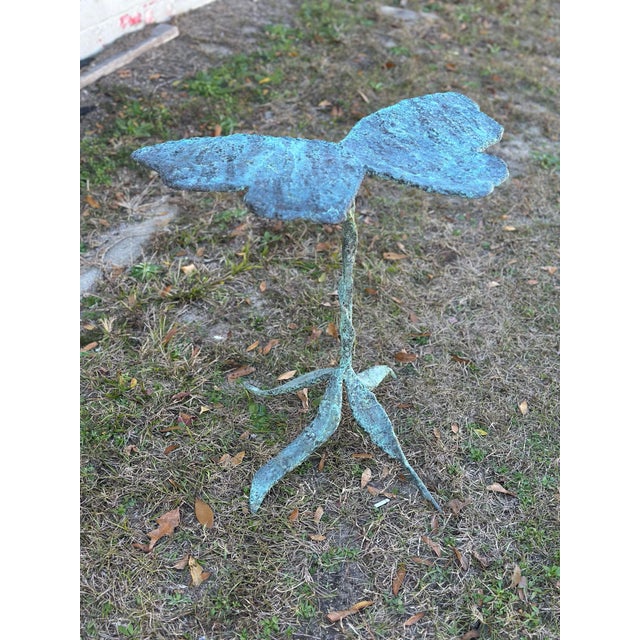 This stunning drink table is hand made of bronze. Finished in a rich vertigo green/blue, it is a nice mix with any color...