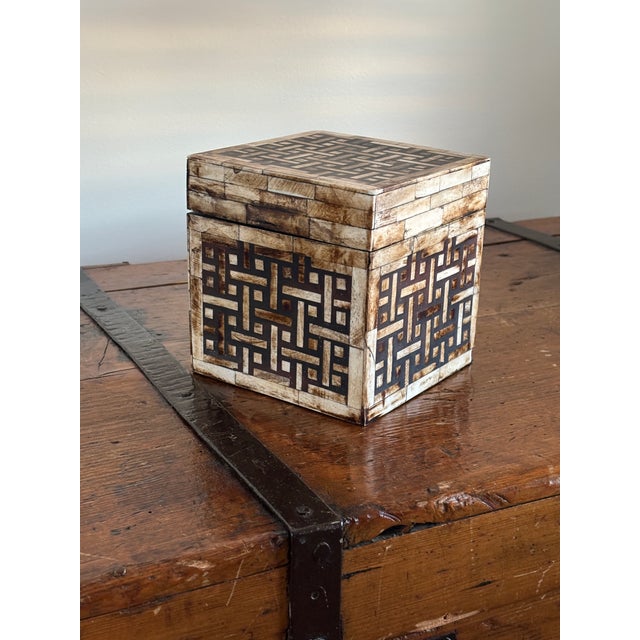 A magnificent and highly graphic vintage Anglo-Indian tall square lidded chest. This Maitland-Smith exceptional piece...