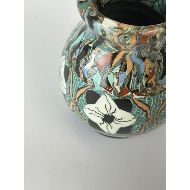 This Jean Gerbino terre mêlée mosaic vase, produced in the Vallauris region of France during the mid-20th century, is a...