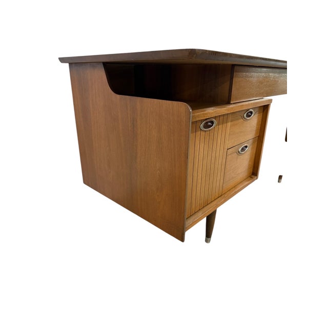This striking Mid-Century Modern walnut desk by Hooker Furniture blends timeless design with everyday functionality....