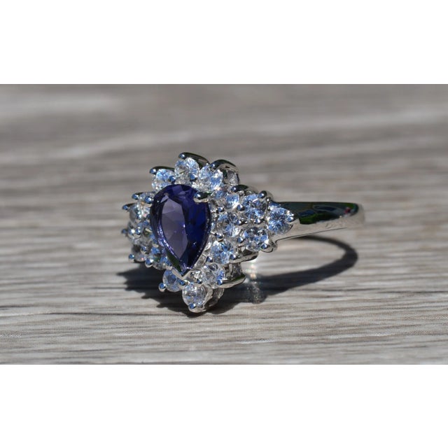 The Betula Ladies White Gold Cocktail Ring set with Iolite and White Zircon. Crafted in polished white gold, this ladies...
