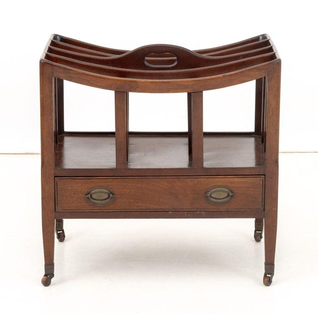 English Regency Mahogany Canterbury, early 19th century, with top handle, four divided slots above two drawers on tapered...