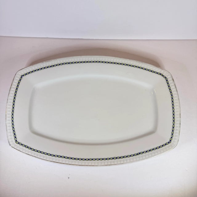An effortlessly elegant piece from turn-of-the-century Silesia, this antique Hermann Ohme platter carries the quiet...