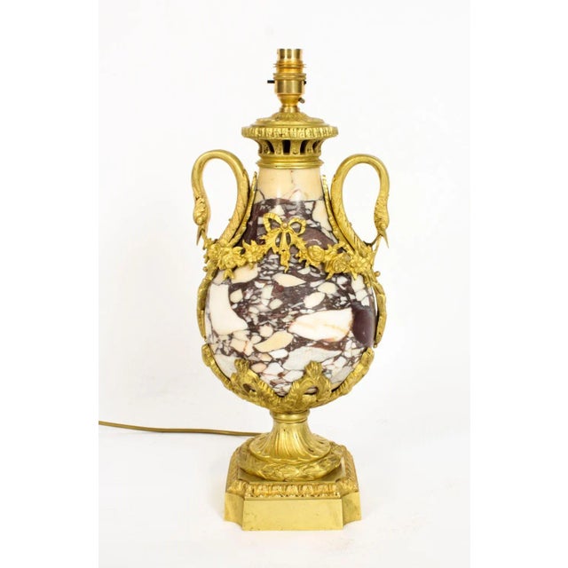 A beautiful French Louis XVI revival ormolu mounted marble table lamp, Circa 1860 in date. This beautiful ormolu mounted...