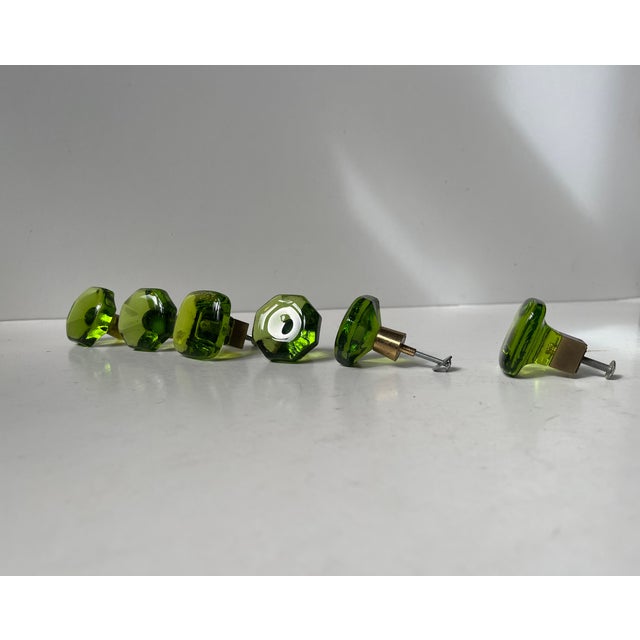 A set of 6 (4/2) glass door/drawer/cabinet knobs. Hand-made in Sweden during the 1960s. Same color with brass spacers but...