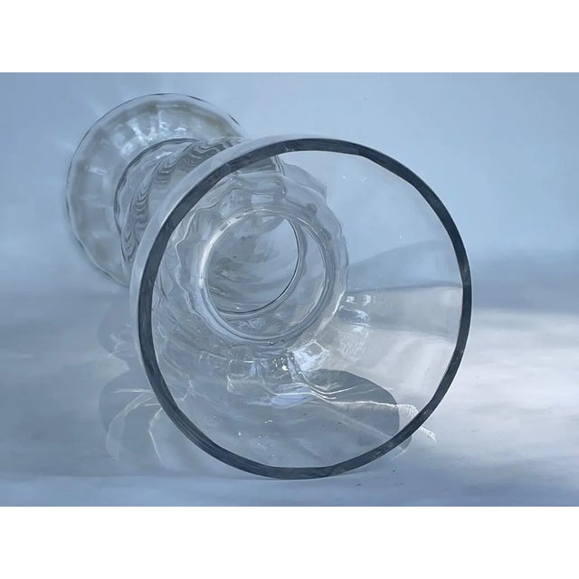 This striking extra-tall glass vase by Studio Nova adds instant, elegant glamor to any space. The handcrafted piece...