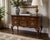 Elegant vintage lowboy by Drexel featuring rich walnut veneers, classic cabriole legs, brass batwing hardware, and a...