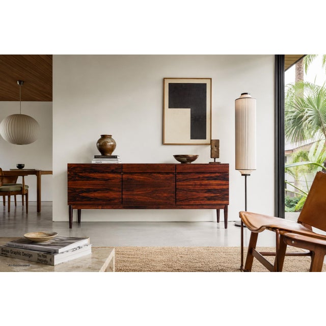 An exceptional Danish modern credenza designed by the highly coveted designer Ib Kofod-Larsen for Faarup Mobelfabrik,...