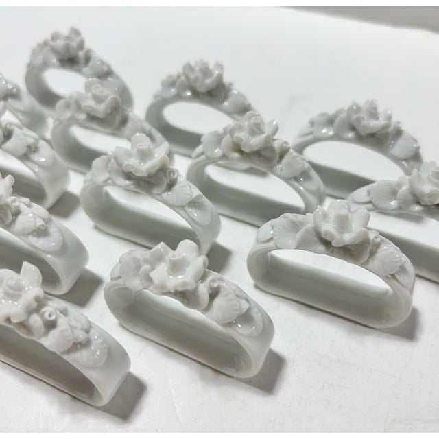 Set of 13 vintage German porcelain napkin rings by Alboth & Kaiser (AK Kaiser), featuring sculptural white roses and...