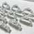Set of 13 vintage German porcelain napkin rings by Alboth & Kaiser (AK Kaiser), featuring sculptural white roses and...