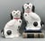 Gorgeous Staffordshire style dogs in the form of black and white spaniels with sweet hand painted faces and pink collars...