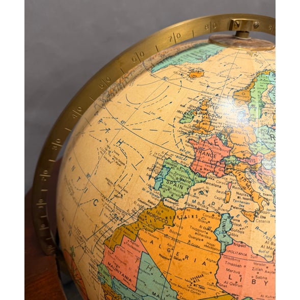 Vintage late 20th century American Replogle “Heirloom” lighted floor globe mounted on a traditional mahogany pedestal...