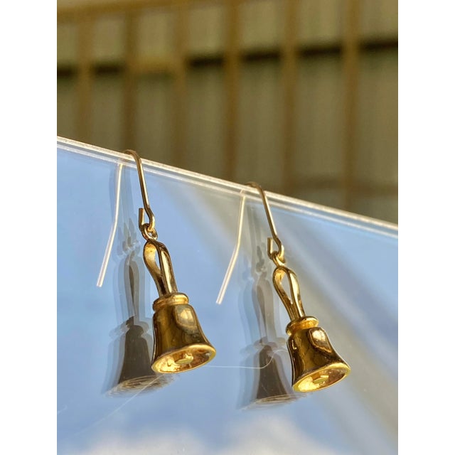 Adorable, swingy hand bell drops. Earrings in solid sterling silver, with a heavy gold wash. Both marked "925". The detail...
