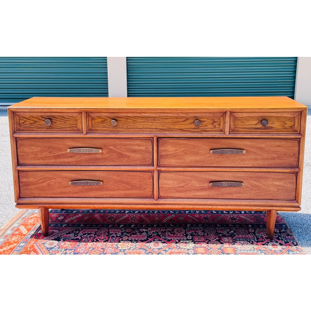 Elevate your interior with this exceptional 1960s Brutalist dresser, expertly crafted by the renowned American...