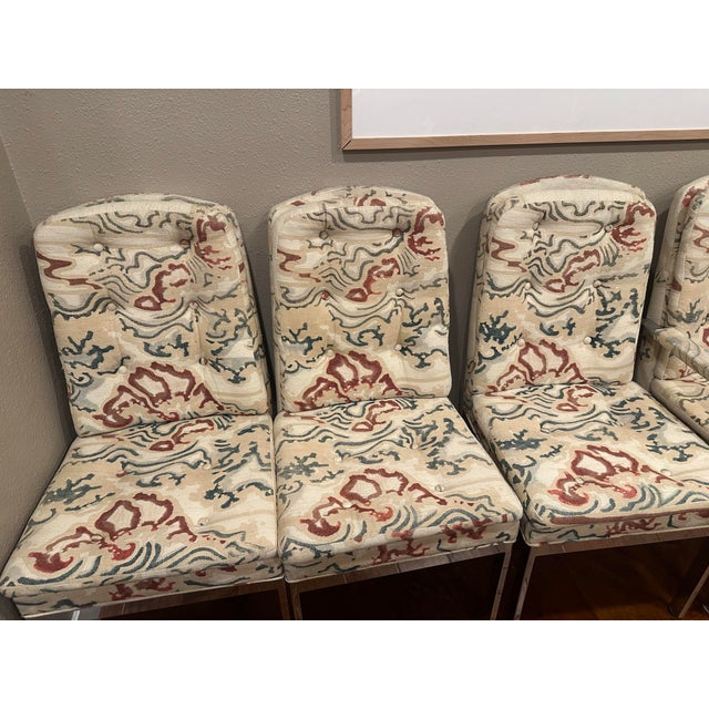 8 dining chairs styled after Milo Baughman. The store we purchased from said they were Baughman but we can’t find...
