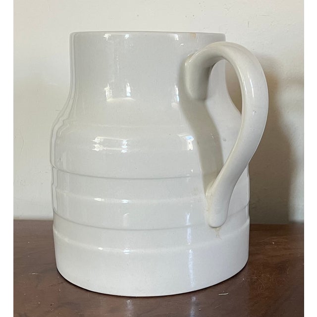 Mid-Century English creamware five pint banded pitcher jug dated 1953 on the base. Measures 7 1/2" tall x 8 1/2" across...